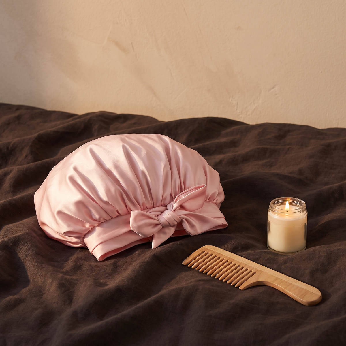 Sleep bonnet on bed with comb and candle, evening scene