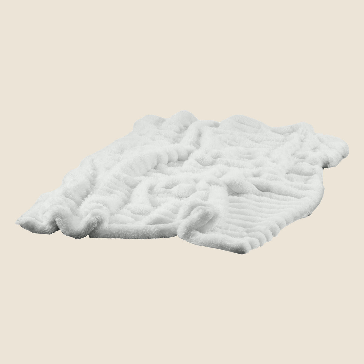 Faux-fur throw laid flat, ribbed texture